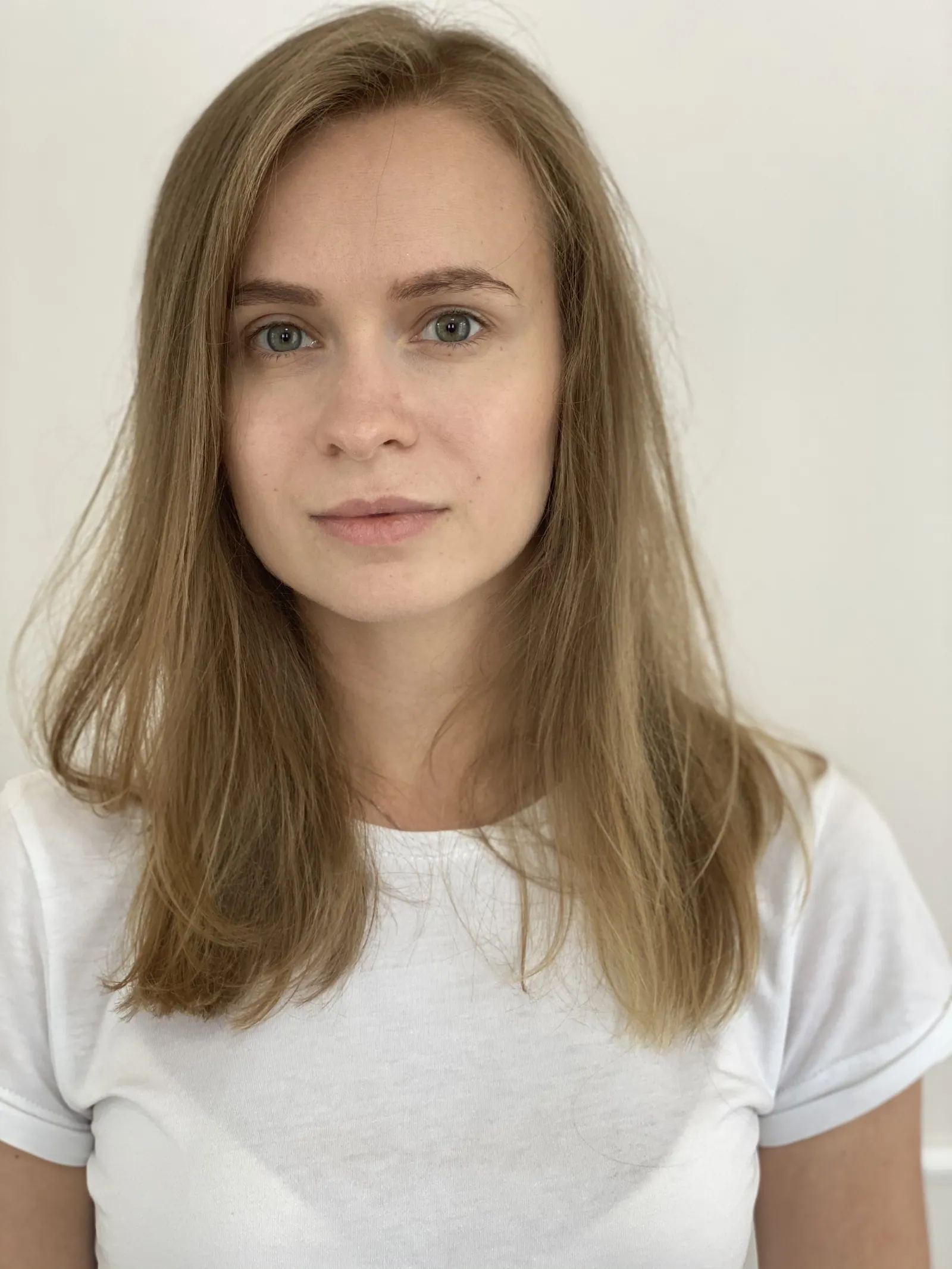 Digital: Krystyna facing the camera in a white T-shirt